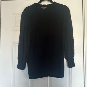 Black sweater with sheer polka dot sleeves